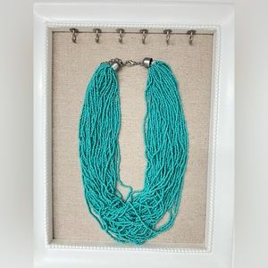 Turquoise beaded necklace.